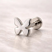 14k white gold butterfly flat back labret stud with post and flat disc backing on marble surface