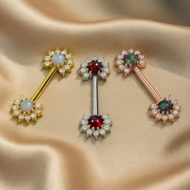 All three gemstone variants of 14k gold diamond halo nipple barbell: white opal, garnet, and black opal