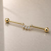 Celeste Arc Industrial Barbell On a reflective glass surface for a lifestyle photograph.