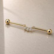 Celeste Arc Industrial Barbell On a reflective glass surface for a lifestyle photograph.
