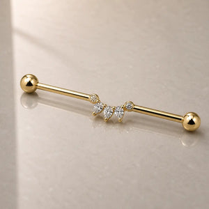Celeste Arc Industrial Barbell On a reflective glass surface for a lifestyle photograph.