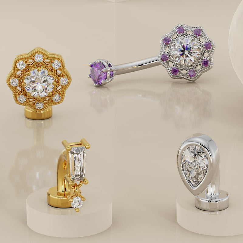 Baguette drop floating navel ring in yellow gold shown alongside other 14k gold belly ring styles