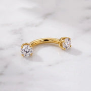 14k gold dainty curved barbell with two 2mm round clear gems