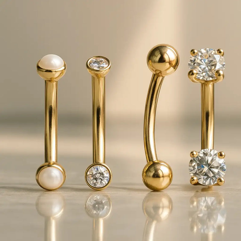 14k yellow gold curved barbells with pearl, CZ bezel, plain ball, and prong-set CZ ends compared