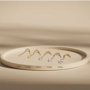 14k gold diamond nose studs in 5 sizes from 1.5mm to 3.0mm displayed on tray for comparison