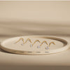 Diamond nose ring size comparison on tray showing 1.5mm through 3.0mm prong-set studs in yellow gold