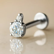 14k white gold CZ and diamond accent flat back cartilage labret, angled view on neutral background