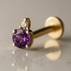 14k yellow gold flat back labret with round amethyst and diamond accent, angled side view