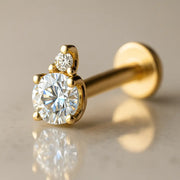 14k yellow gold flat back labret with CZ and diamond accent in prong setting, angled side view