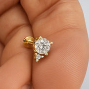14k yellow gold diamond accent flat back labret held in palm for size reference, clear stone variant