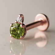 14k rose gold peridot and diamond flat back labret, angled view showing warm-toned prong setting