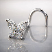 14k white gold diamond butterfly nose ring with twist backing on reflective surface