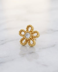 Diamond ends and charms - 14k yellow gold milgrain daisy flower threadless stud end with centre diamond on white marble