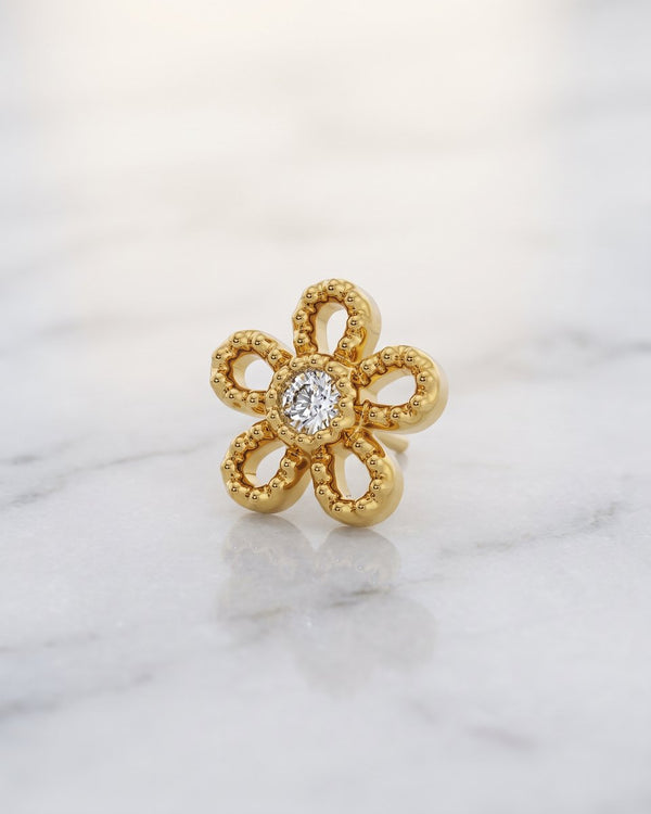Diamond ends and charms - 14k yellow gold milgrain daisy flower threadless stud end with centre diamond on white marble