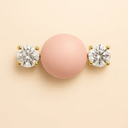 14k yellow gold GIA diamond nipple barbell shown on body prop illustrating fit and placement