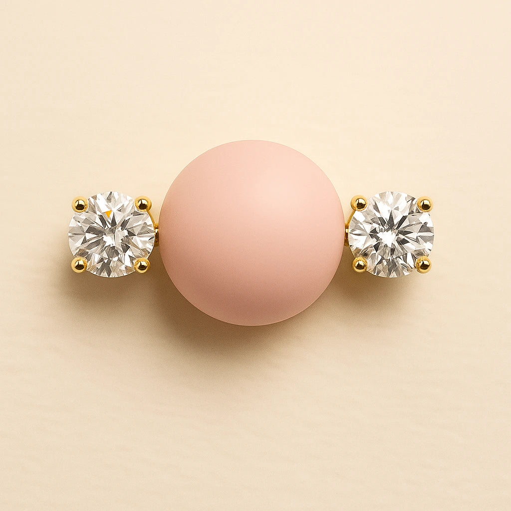 Close-up of 14k yellow gold diamond nipple barbell ends showing four-prong round brilliant diamond settings and scale