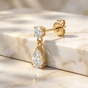 Diamond Pear Drop Stud Earring in 14K yellow gold, angled view showing standard butterfly earring back