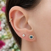 3.5mm diamond bezel flat back stud worn in lobe piercing, styled in a gold ear stack