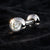 Close-up of 14k white gold diamond tongue ring on dark velvet, diamond sparkle detail