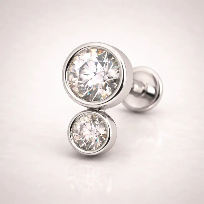 14k white gold diamond bubble flat back stud, angled view highlighting polished bezel settings and post