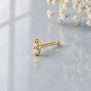 14K yellow gold double diamond nose bone style, angled side view showing ball-end post