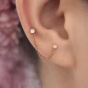 14k rose gold duo gem chain connector worn on ear, linking lobe and lower cartilage piercings