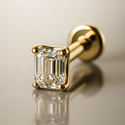 14k yellow gold 3mm emerald-cut diamond flat back labret stud, angled studio shot showing prong setting