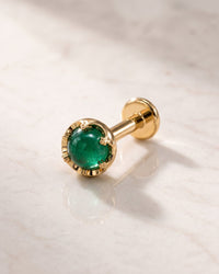 Gemstone flat back earrings - 14k yellow gold Reina crown-set emerald flat back stud on white marble