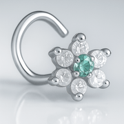 14K white gold CZ flower nose ring twist with aqua center CZ, angled close-up on gray background