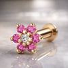 14k yellow gold pink CZ flower flat back labret, angled view showing 7-stone daisy charm and post