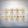 14K yellow gold CZ flower nose bone collection showing all 8 birthstone center color options