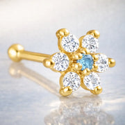 14K yellow gold flower nose bone with light blue aquamarine CZ center and clear CZ petals