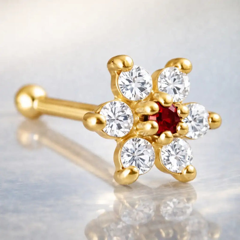 14K yellow gold CZ flower nose bone with red ruby CZ center stone, angled product view