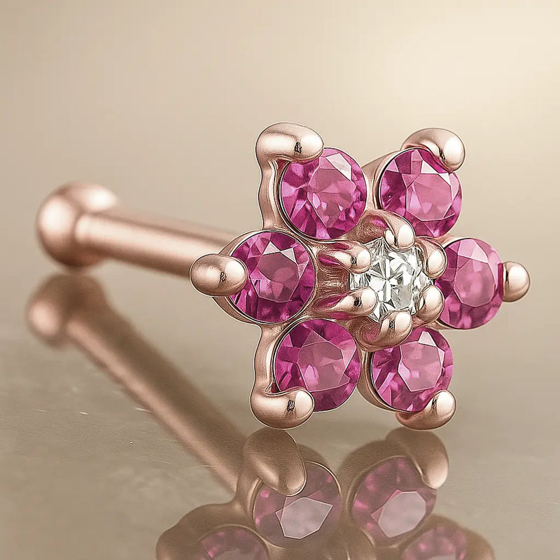 14K rose gold flower nose bone with pink CZ petals and clear CZ center, angled product view