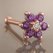14K rose gold flower nose bone with purple CZ petals and clear CZ center, angled product view