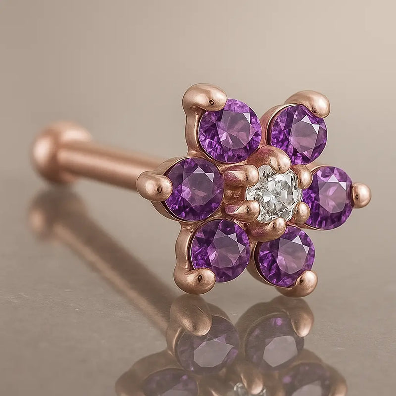 14K rose gold flower nose bone with purple CZ petals and clear CZ center, angled product view