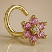 14K yellow gold flower nose twist with pink CZ petals and clear center CZ, angled view