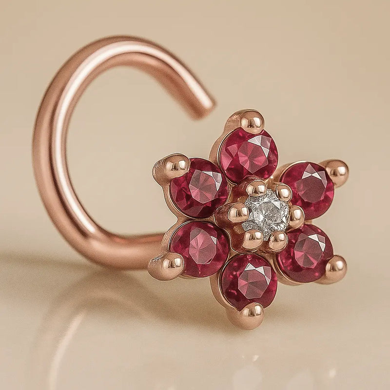 14K rose gold flower nose twist with red CZ petals and clear center CZ, angled product view