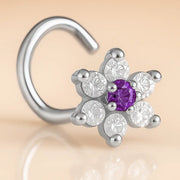 14K white gold CZ flower nose ring twist with purple amethyst center CZ, angled close-up view