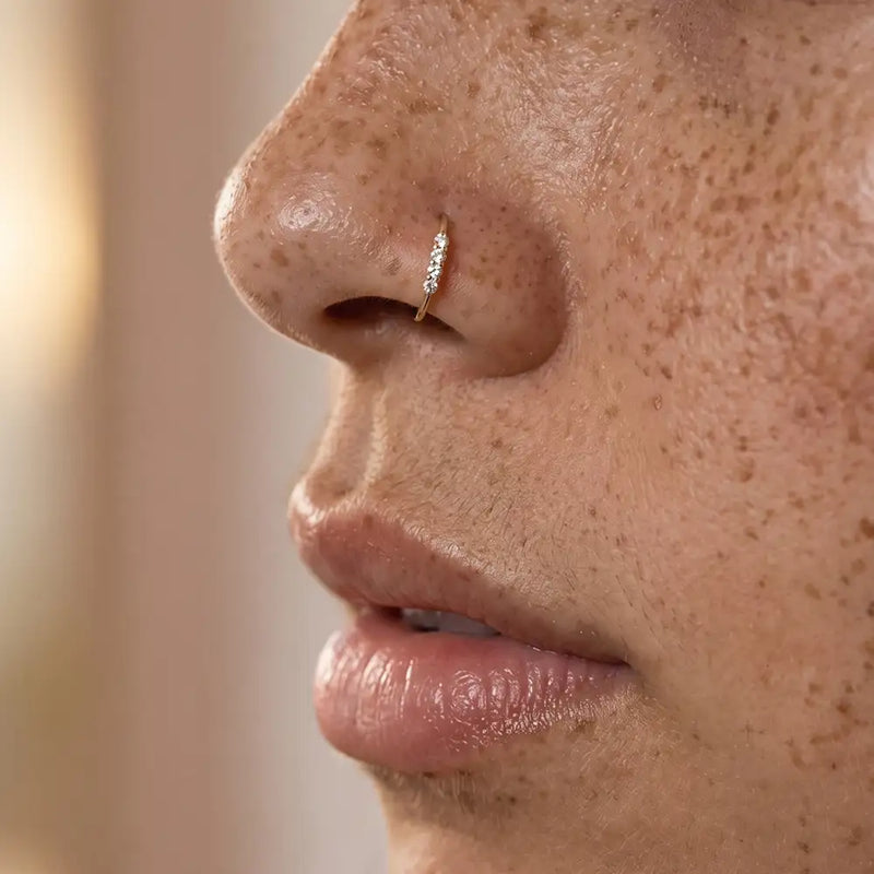 Side-set four-diamond hoop nose ring in solid 14k gold - for nostril piercings