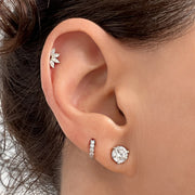 14k white gold marquise fan stud shown in cartilage piercing on model, styled with other ear jewelry