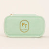 FreshTrends mint green travel jewelry box, closed front view with gold FT Est. 2003 logo
