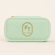 FreshTrends mint green travel jewelry box, closed front view with gold FT Est. 2003 logo