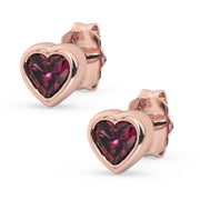 14k rose gold rhodolite garnet heart stud earrings pair, product render highlighting warm gold and deep pink stone