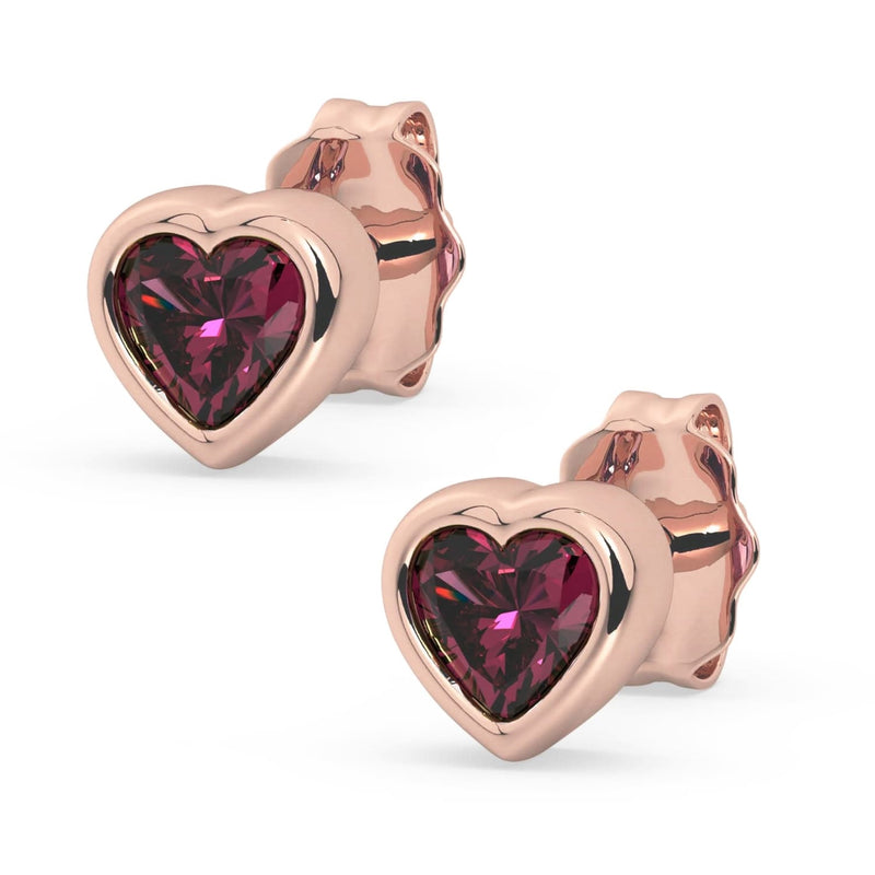 14k rose gold rhodolite garnet heart stud earrings pair, product render highlighting warm gold and deep pink stone