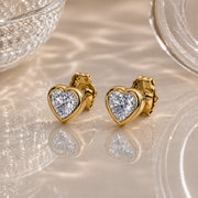 14k yellow gold white sapphire heart stud earrings pair, clear stones with brilliant facets, angled view