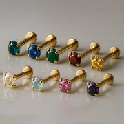 14K yellow gold prong-set flat back labrets in nine gemstone colors including emerald, sapphire, ruby, and amethyst