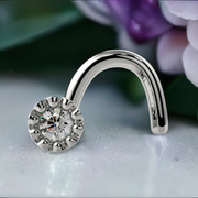 14k white gold diamond perlage nose screw with milgrain bezel, styled with floral background