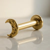 14K yellow gold hammered crescent moon flat back labret, angled view showing post and flat disc back