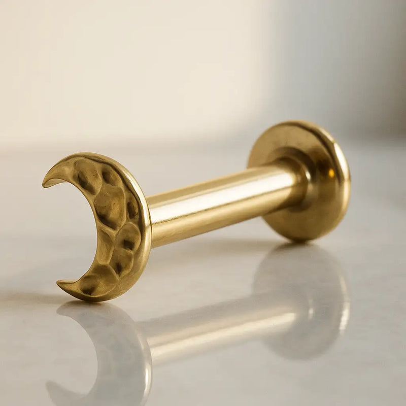 14K yellow gold hammered crescent moon flat back labret, angled view showing post and flat disc back